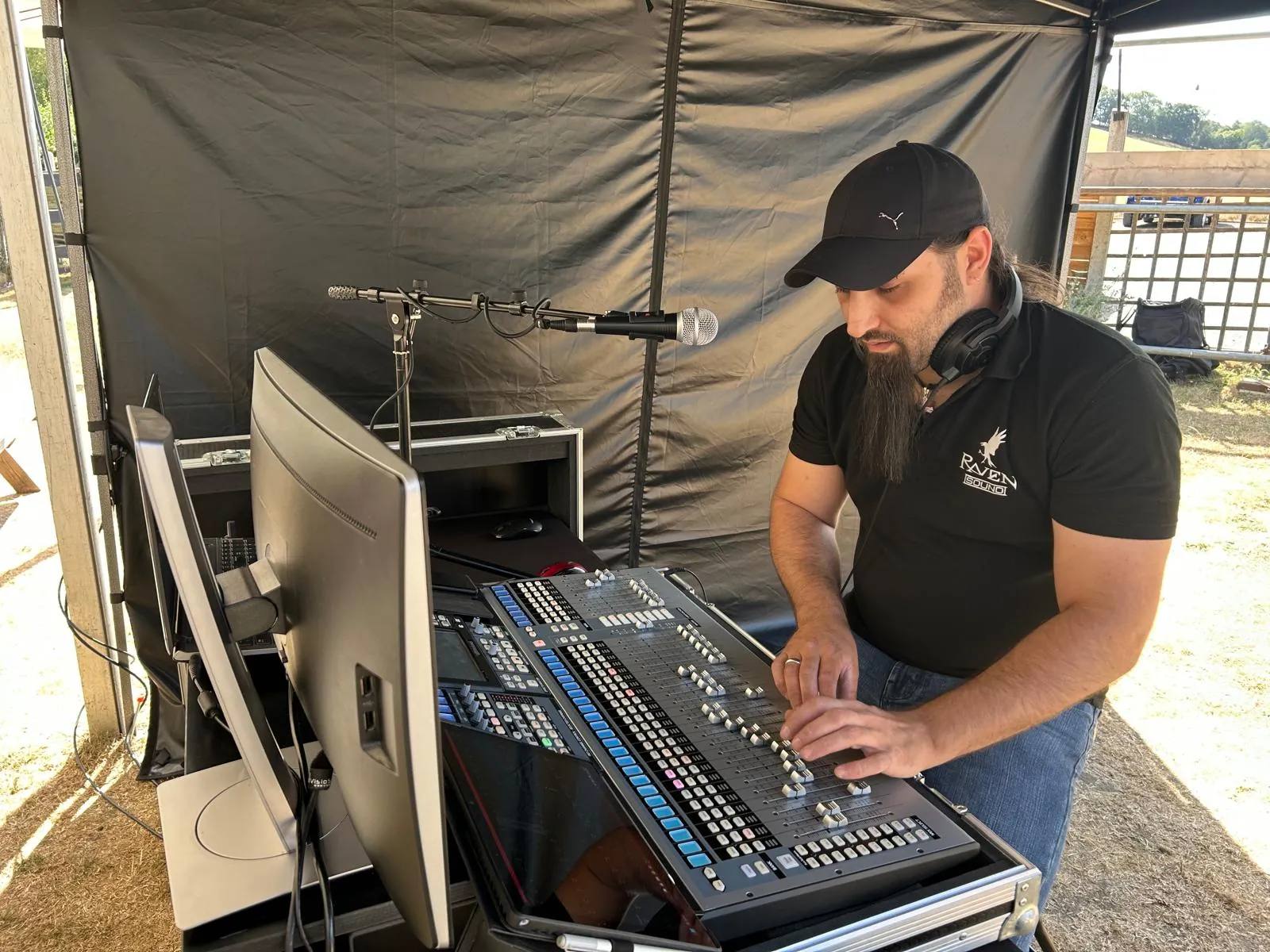 Jamie mixing a live show from the sound tent