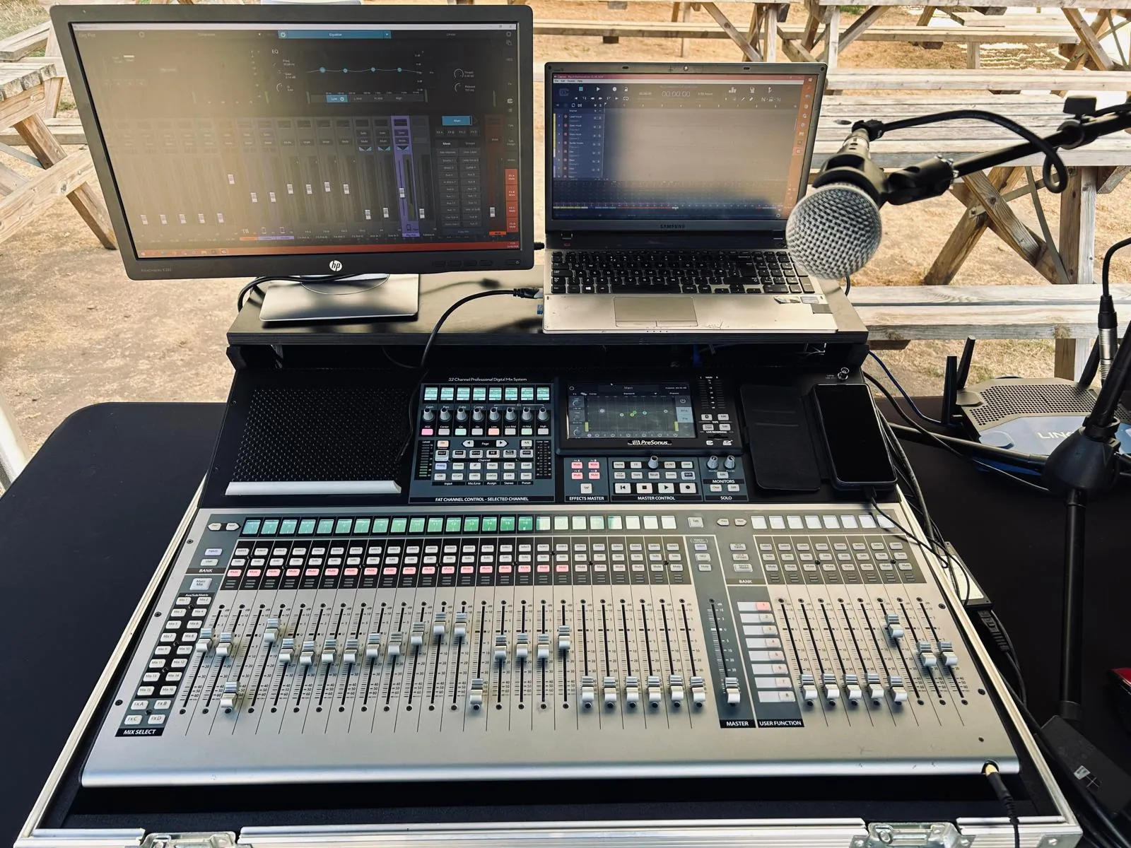 The mixing desk with its monitor and laptop